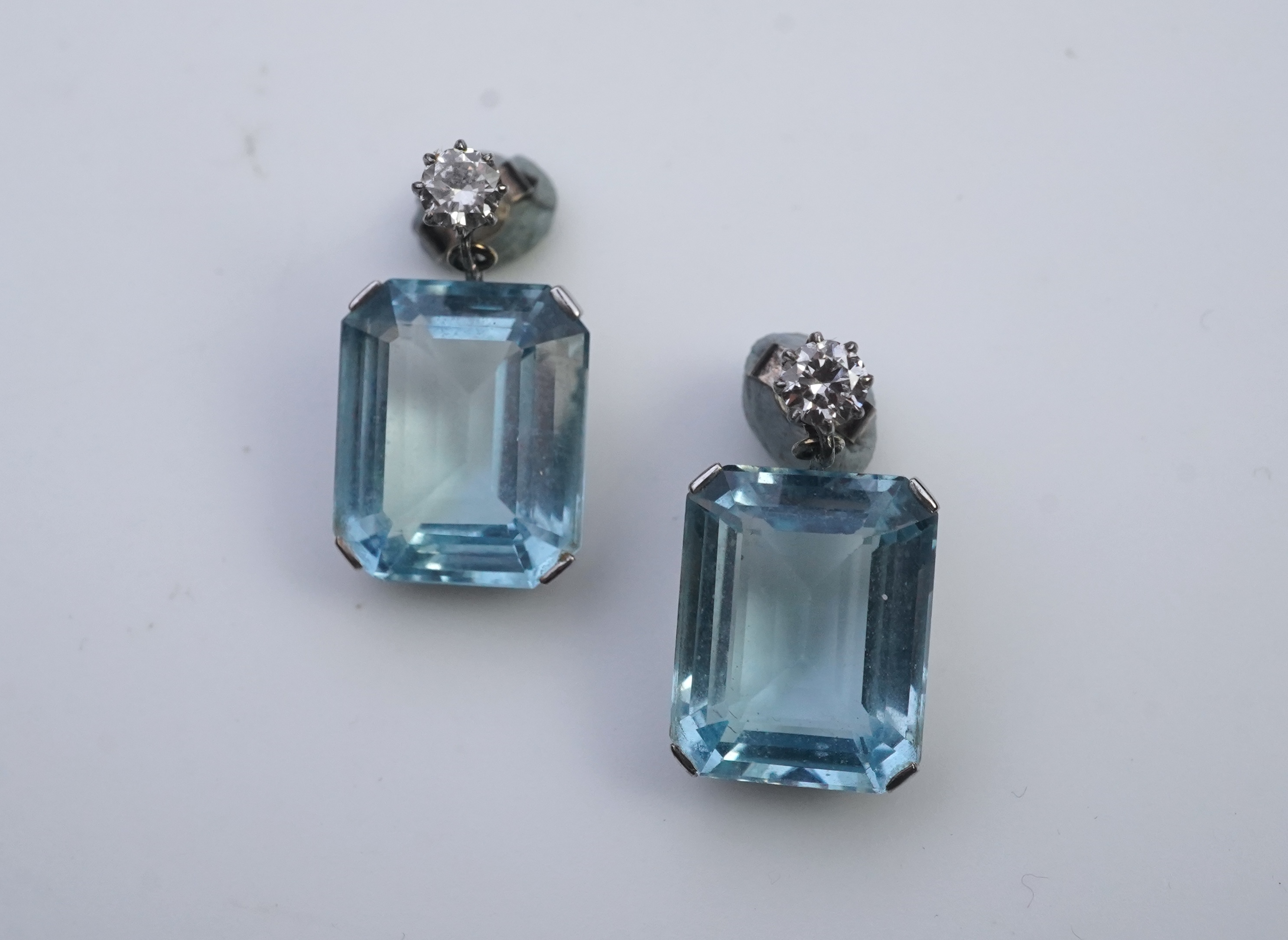 A pair of aquamarine and diamond earrings